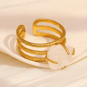 Detail of 18K gold-plated triple-layer open ring with a raw white crystal stone
