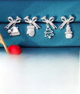 Detailed view of Christmas themed titanium steel stud earrings with zirconia stones