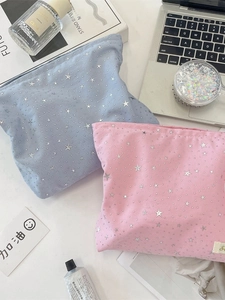 Star sequin makeup bags in blue and pink colors for travel skincare storage