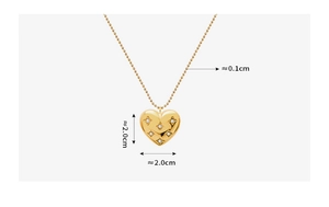 Detail shot of heart pendant with star engraving and crystals, size 2.0x2.0cm