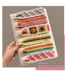 Detail of six colorful French retro knitted headbands with handmade crochet patterns