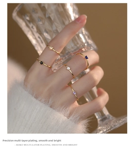 Detail of five-piece heart gemstone rings set with multi-layer gold plating