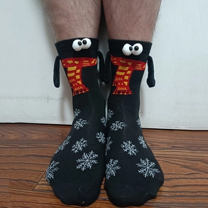 Detail of creative magnetic monster socks with 3D eyes and snowflake patterns