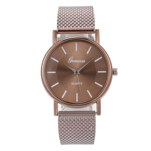 Macro view of rose gold mesh band watch with sunray dial and sleek bar markers