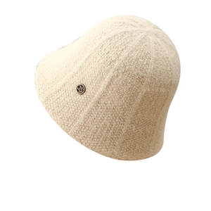Beige plush knit bucket hat with a circular gold JS metal badge for women's autumn winter