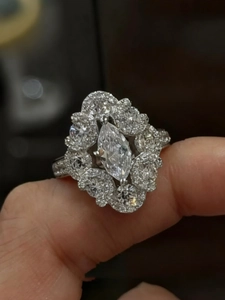 Detailed shot of a marquise-cut zircon cluster ring with sparkling silver setting