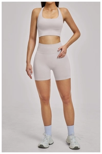 Close-up of lilac ribbed high-waisted yoga shorts and sports bra seamless gym set
