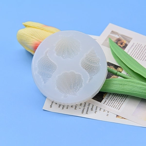 Round silicone seashell mold with four detailed ocean patterns for DIY resin and baking
