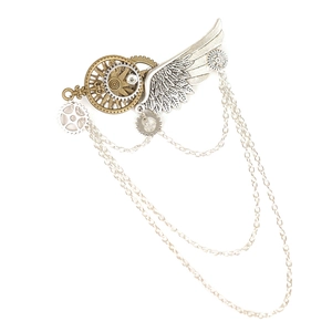 Detail of steampunk gear brooch featuring metal wings and dangling chains in retro style