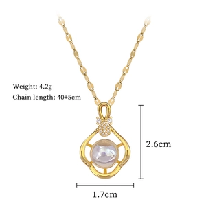 Golden pineapple pendant necklace detail with center pearl and pavé crystals on a 40cm chain