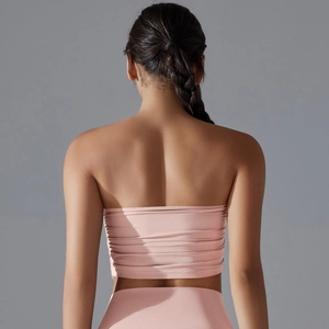 Close-up of pink ruched bandeau yoga top with high-stretch fabric and seamless back detail