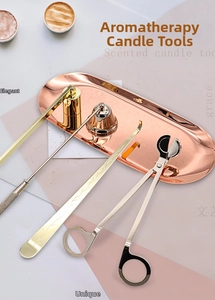 Detailed view of rose gold stainless steel candle care set with tray and tools