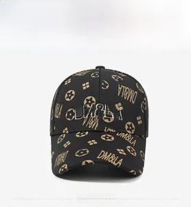Detailed front view of black baseball cap with beige logo embroidery and all-over pattern