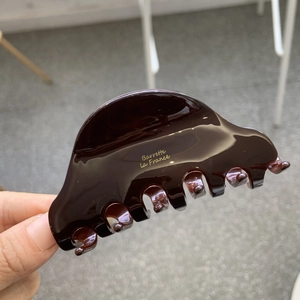 Elegant dark brown acetate hair claw clip with gold Barrette La France text print