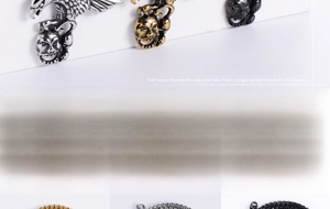 Macro view of vintage eagle and skull pendants with gold, silver, and black metal chains