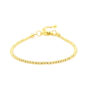 Minimalist gold beaded bracelet featuring polished metal spheres and adjustable lobster clasp