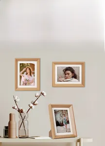 Detail of light oak wood picture frame with white mat for desktop and wall display