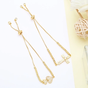 Detail of adjustable box chain bracelets with sparkling heart and cross cubic zirconia
