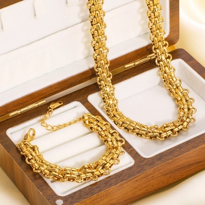 Three-layer braided gold stainless steel necklace and bracelet set in a wooden jewelry box