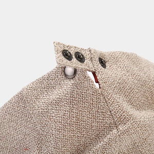 Beige woven textured newsboy cap with adjustable silver metal snap closure
