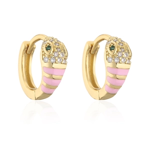 Close-up of gold snake earrings with pink enamel and white zircon stone details