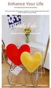 Detail of plush heart-shaped decorative pillows in a modern interior setting
