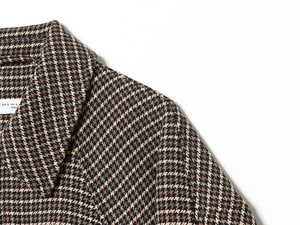Detailed close-up of houndstock pattern wool jacket showing collar and stitching