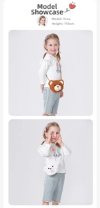 Detail view of plush bear crossbody bags in brown and white on a 110cm child model