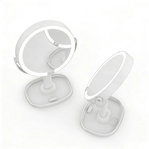 Detail of white desktop LED makeup mirror with adjustable stand and storage base tray