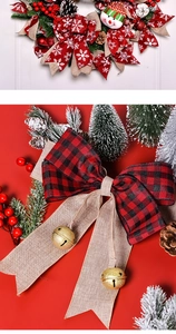 Close-up of red plaid Christmas bow with pine cones, golden bells, and snowman decor