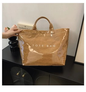 Brown Dupont paper tote bag with clear PVC outer layer and TOTE BAG lettering detail