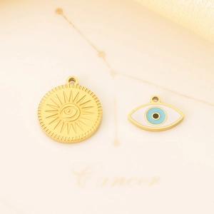 Detail of 18K gold evil eye charms and sunburst pendants for DIY jewelry design