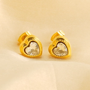 Elegant gold heart stud earrings with sparkling clear cubic zirconia on silk background
