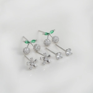 Three-pair S925 silver needle stud earring set featuring cherry, flower, and crystal designs