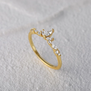 Macro shot of V-shaped crown ring with sparkling marquise and round cubic zirconia