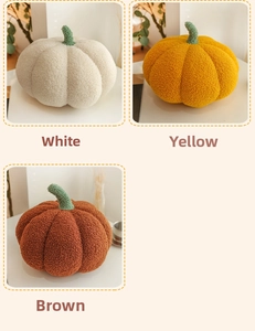 Detail of soft sherpa fabric pumpkin throw pillow showing cozy texture and green stem