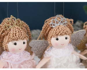 Detailed close-up of handmade Christmas angel ornaments with lace and glitter wings