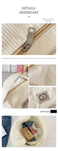 Detail of white corduroy makeup bag with zipper closure and cute bear patch decoration