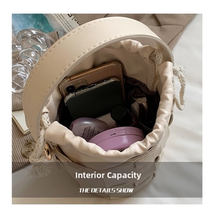 Detail view of woven bucket bag interior showing spacious capacity for daily cosmetics