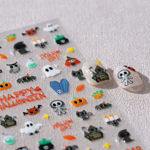 3D Halloween nail art stickers with pumpkin, ghost, and castle patterns on a matte surface