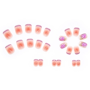 Pink and purple gradient press-on nails with 3D grape beads and French tip accents