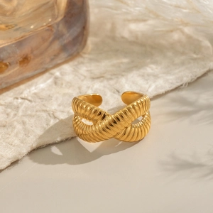 Crossed textured gold croissant ring in 18k gold finish with a minimalist aesthetic