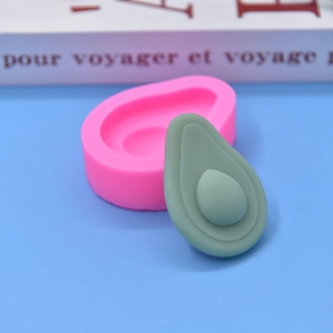 Avocado shaped silicone mold for DIY baking and mousse cake creation on blue background