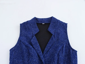 Detailed close-up of a navy blue sleeveless V-neck tweed vest with elegant collar design