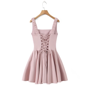 Detailed back view of pink A-line dress featuring elegant cross-tie lace-up straps