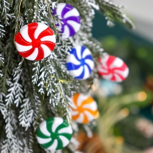 Colorful peppermint lollipop Christmas tree ornaments with festive spiral patterns