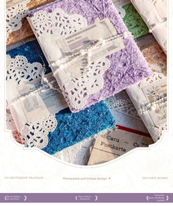 Detail of vintage French style textured craft paper with lace border and cotton twine tie