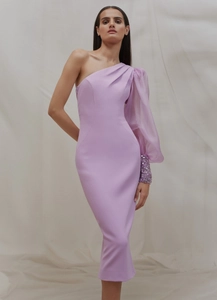 Detail of purple one-shoulder evening gown with sequined cuffs and sheer lantern sleeve