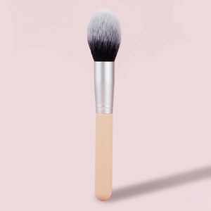 Detail of soft bicolored fiber bristles and sleek matte handle on this powder brush