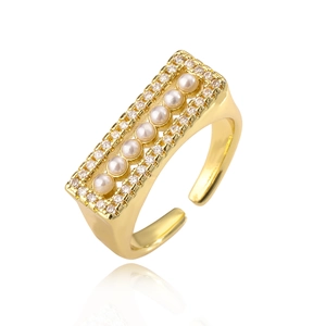 Elegant gold plated ring with rectangle pearls and cubic zirconia on white background